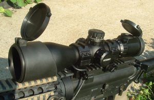 UTG 3-12x44 Compact Scope mounted on a lever-action rifle, showcasing its tactical turrets and precision focus.